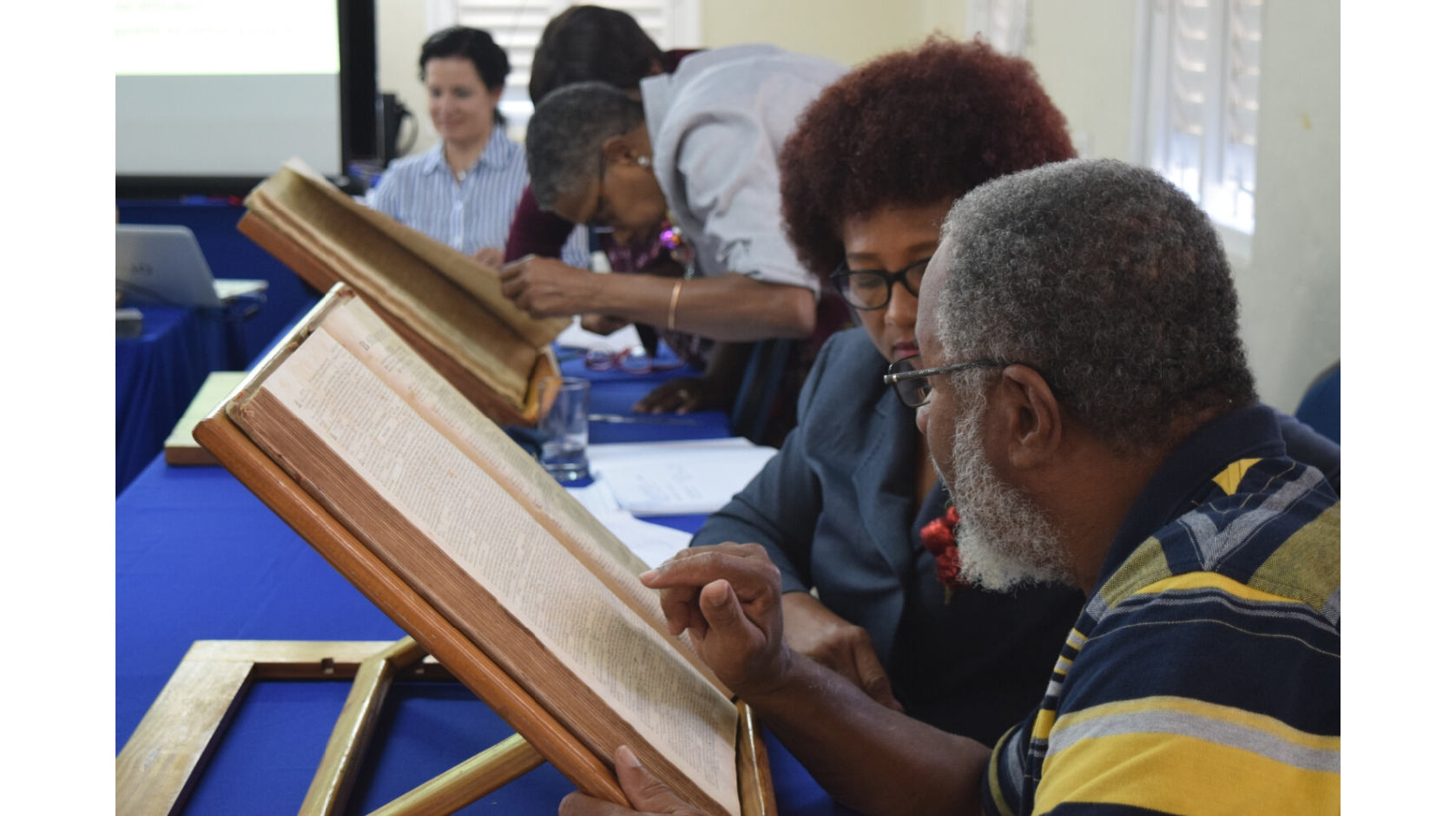 Workshop participants engaging with the print copies of the *Mercury*, 12 December 2017